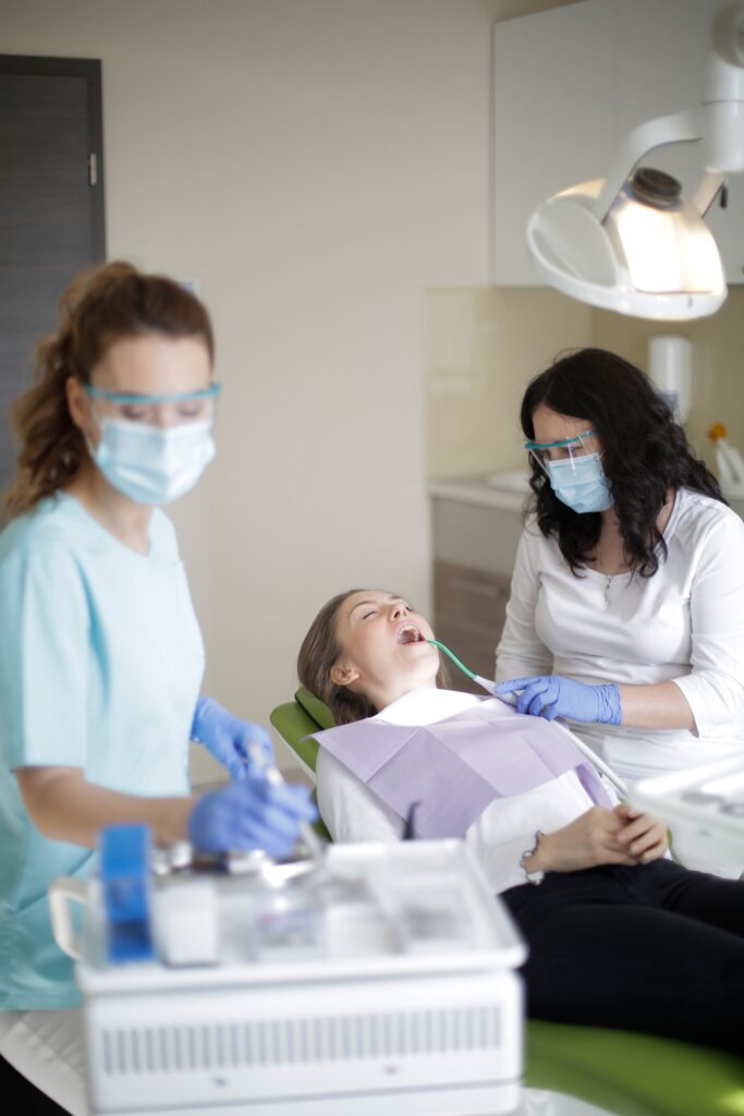 Dental assistant and dentist working together in a clinic