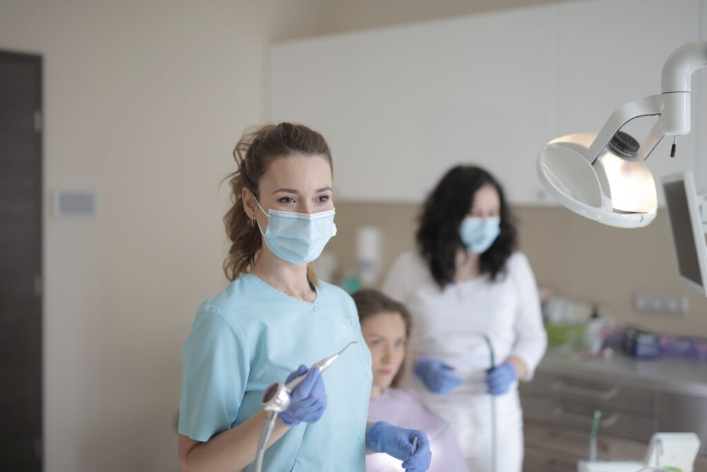 Dentist and assistant working together during patient treatment
